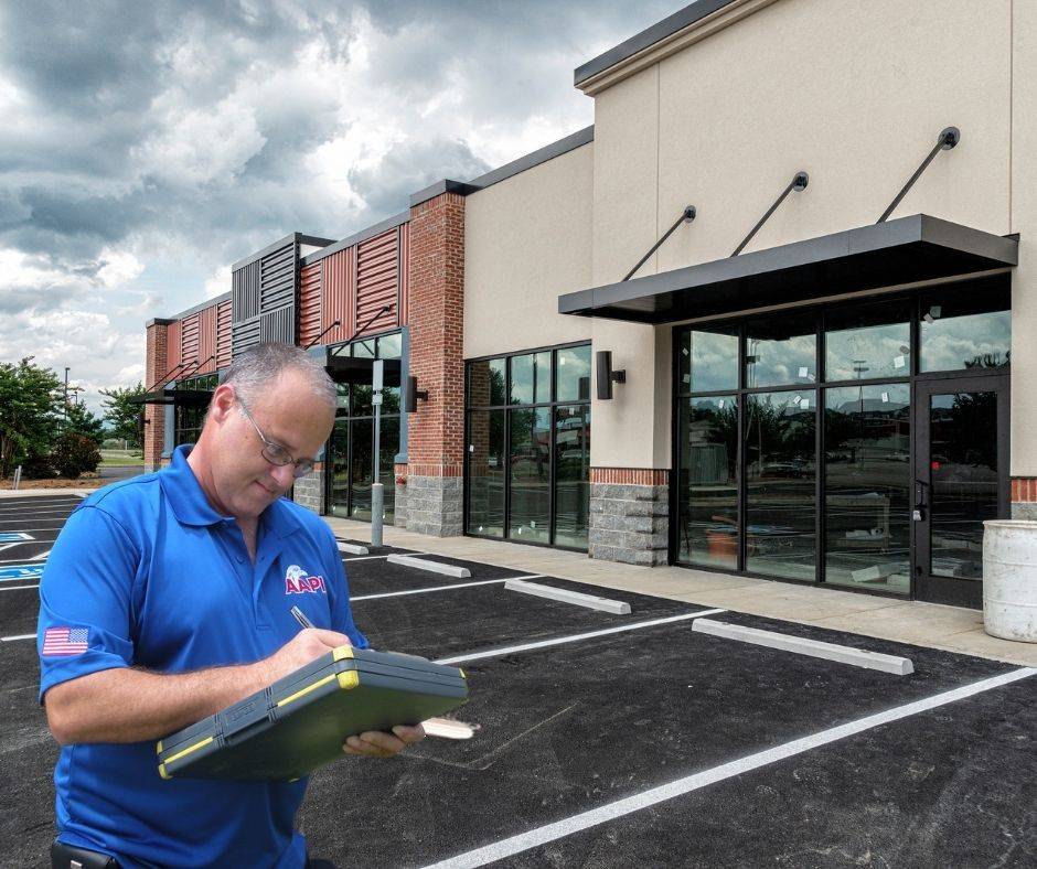 Bill Ostoyic inspecting a commercial strip mall building